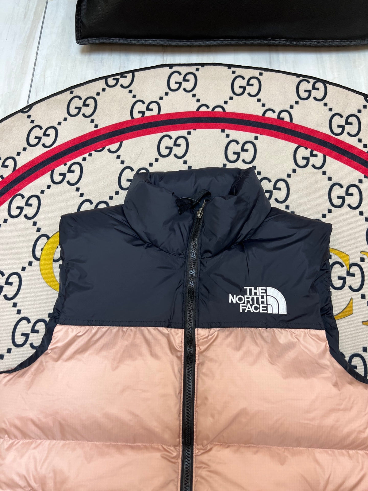 The North Face Blush Pink and Black Colorblock Puffer Vest
