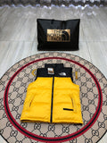 The North Face Yellow and Black Colorblock Puffer Vest