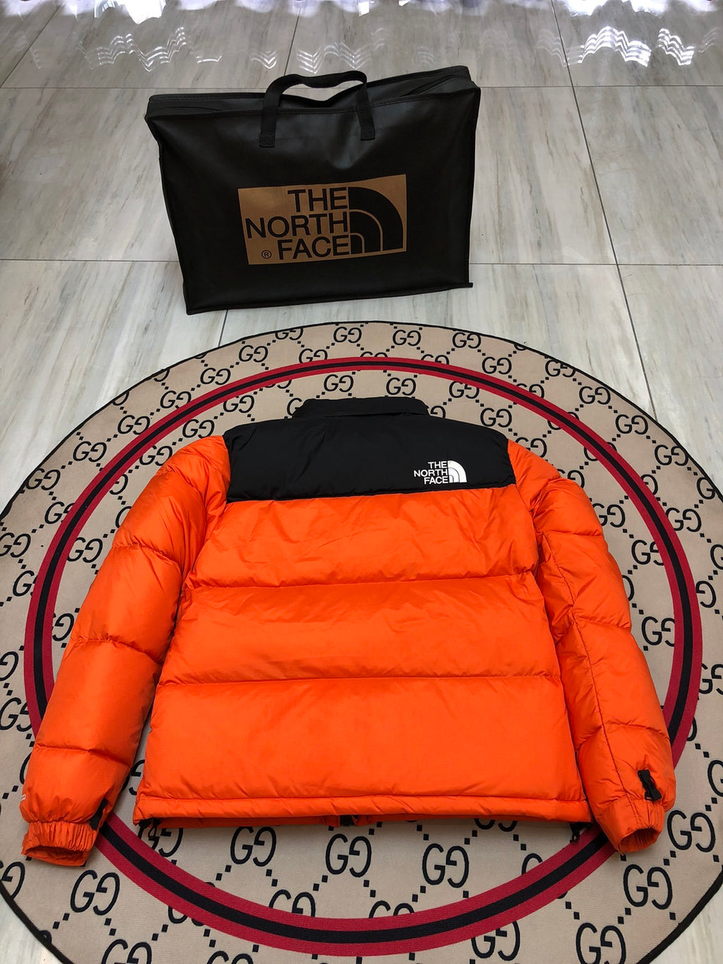 The North Face Orange and Black Colorblock Puffer Jacket