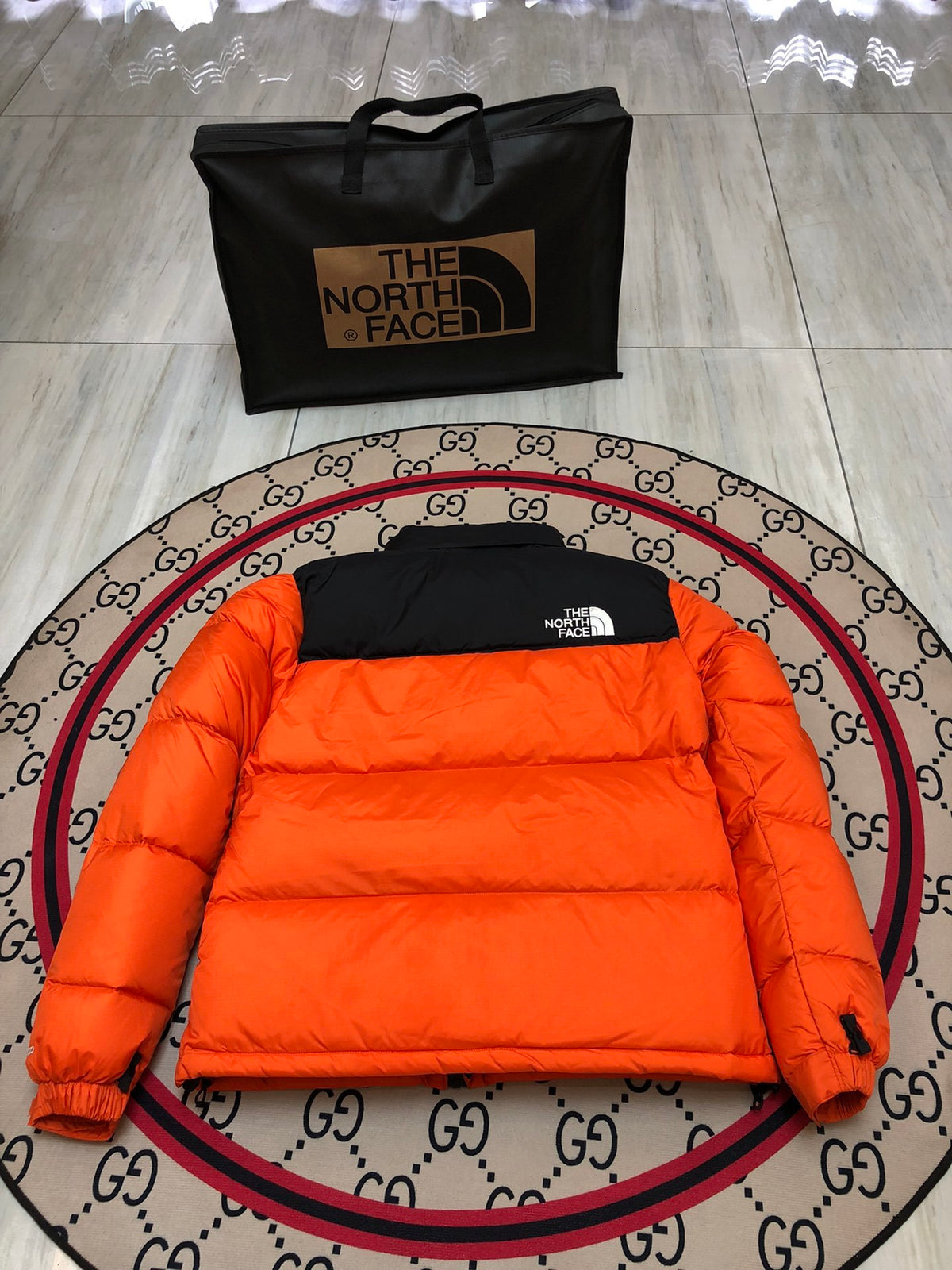 The North Face Orange and Black Colorblock Puffer Jacket