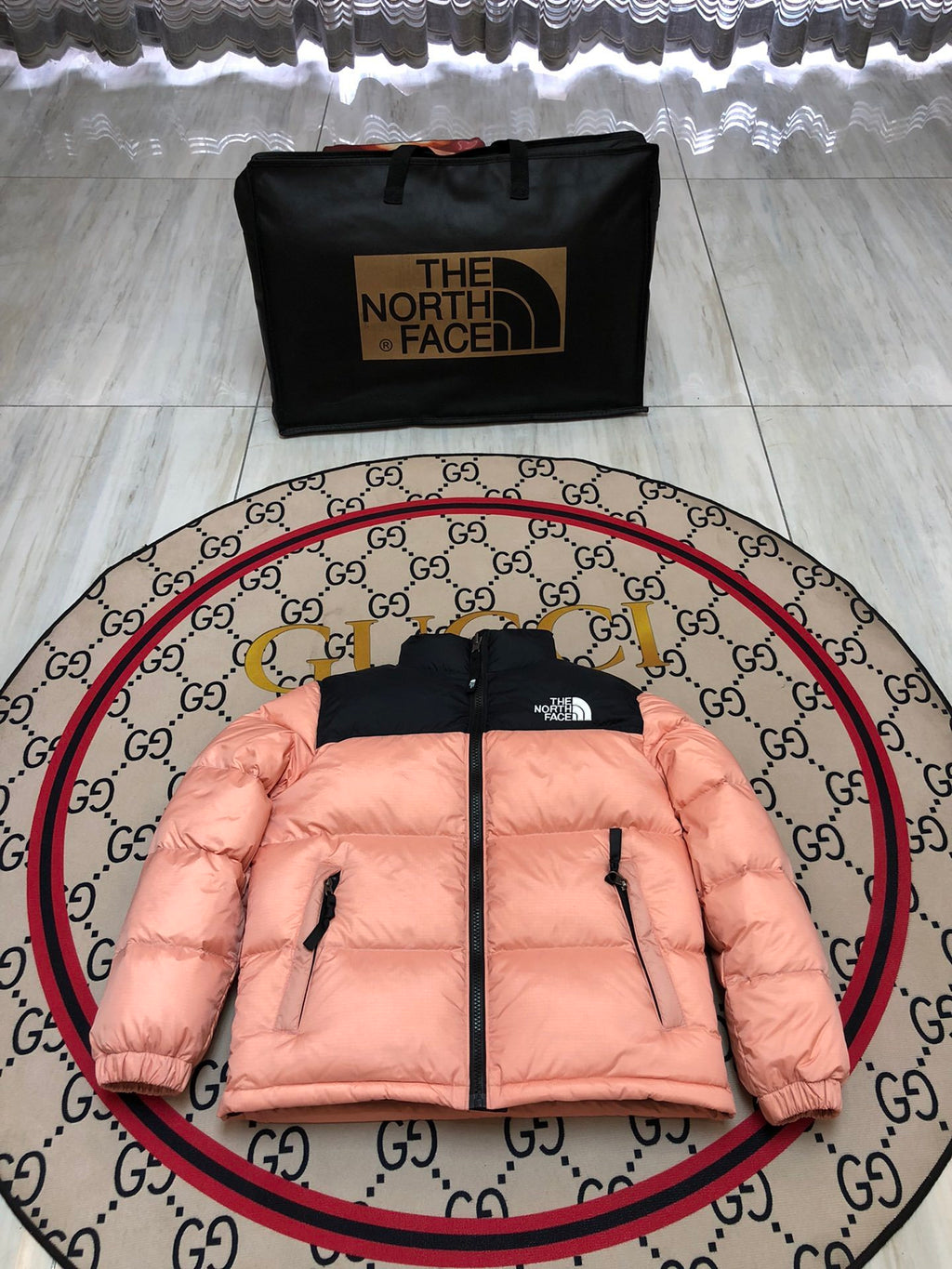The North Face Peach Pink and Black Colorblock Puffer Jacket